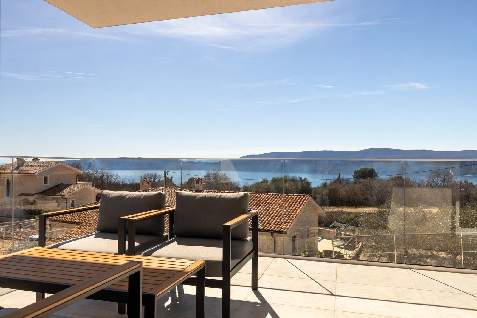 Villa Neoma poolside loungers and relaxation area